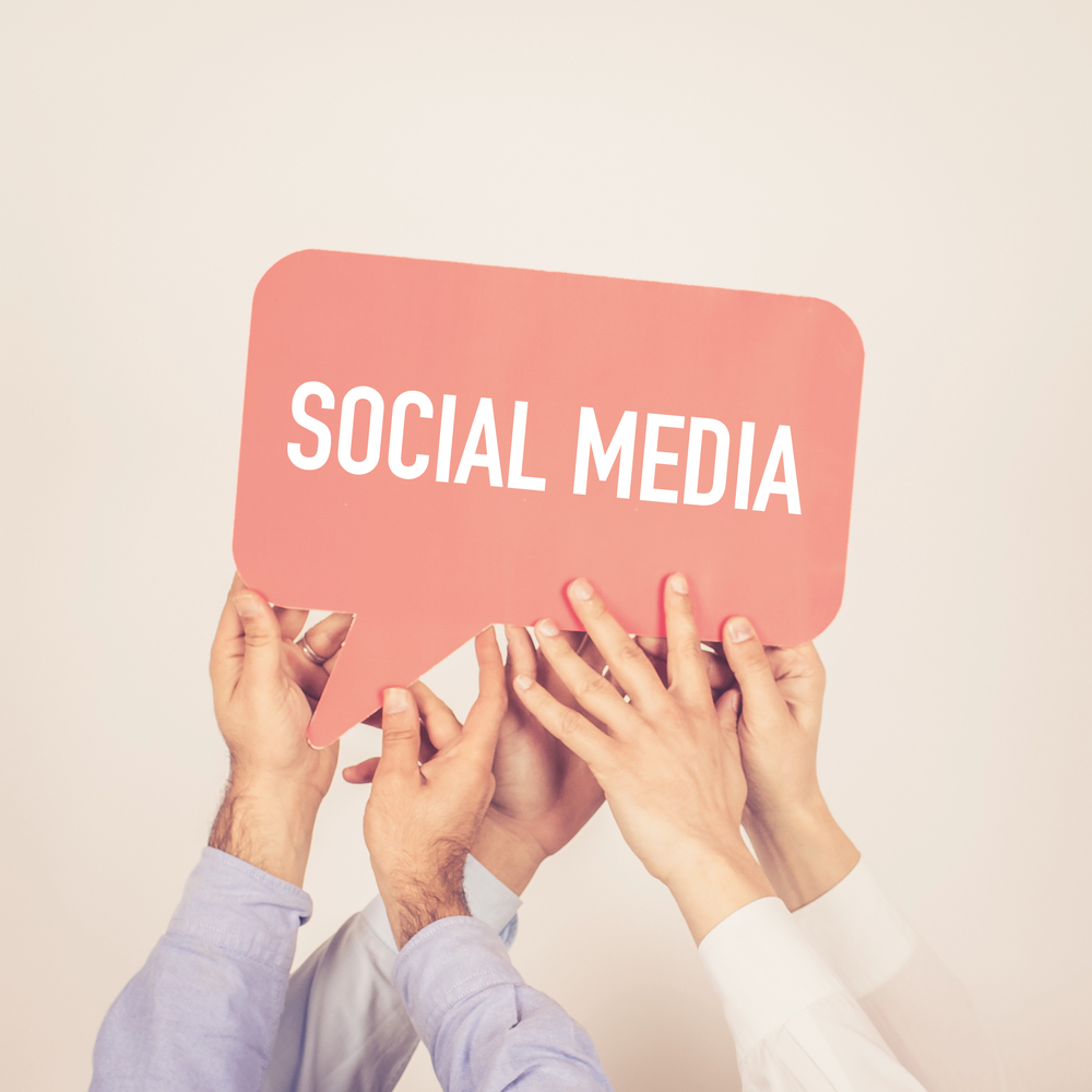 a,group,of,people,holding,the,social,media,written,speech