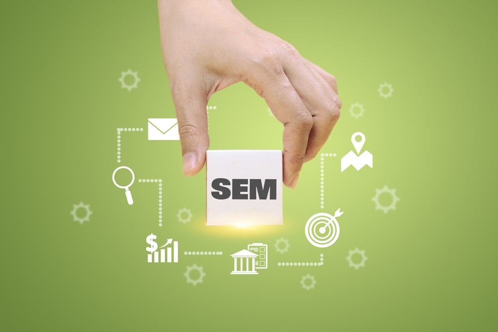 a,hand,holds,a,block,labeled,"sem",surrounded,by,digital